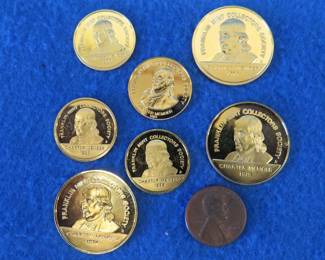Lot 401. 33.3 grams of 24kt gold electroplated sterling silver collector coins