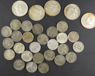Lot 31. Twenty-five 35% war nickels and five 40% Kennedy Halves