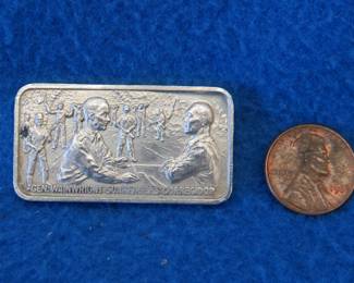 Lot 317. 1976 Lincoln Mint WWII commemorative sterling silver bar. 43.7 grams.