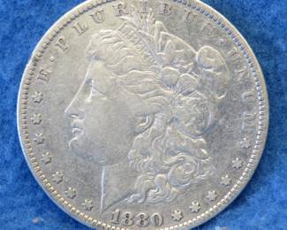 Lot 403. 1880 O Morgan silver dollar