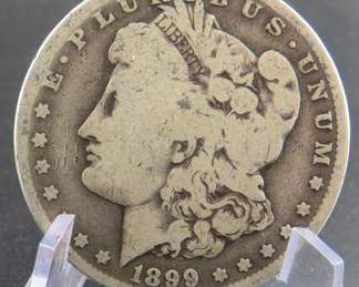 Lot 387. 1899 O Morgan silver dollar