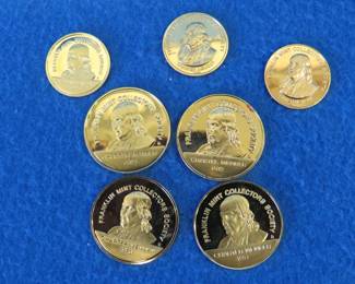 Lot 402. 37.1 grams of 24kt gold electroplated sterling silver collector coins