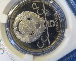 Lot 291. USSR 1980 Olympic 5 Ruble coin contains .999 silver and weighs .48 oz. Notwithstanding the label, minted in the USSR.