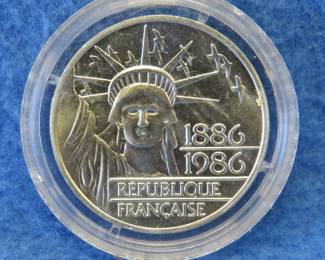 Lot 406. 1986 French 100F sterling silver coin. 30.3 grams.