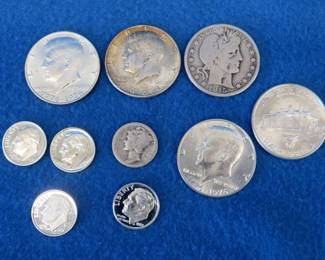 Lot 299. $3.00 face value 90% silver coins including a 1915 S Barber half dollar
