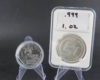Lot 38. One 999 fine silver troy ounce Liberty Silver round, and a 1986 French 100 Francs .925 sterling silver coin weighing 30.02 grams