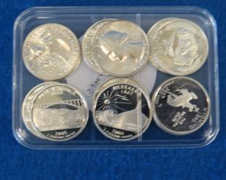 Lot 248. Twelve proof 90% silver State Quarters. $3.00 face value.