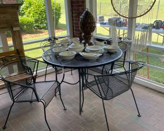 View of back porch with wrought iron table and chairs