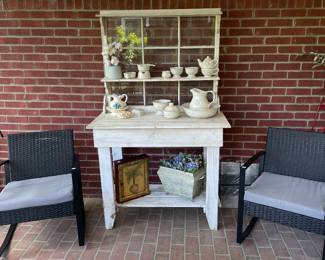 Painted potting bench with black wicker rockers