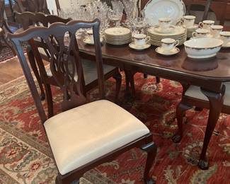 One of 9 Chippendale dining chairs