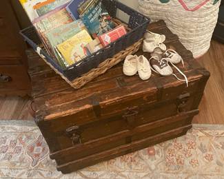 Wonderful flat top 3 quarter trunk with vintage children’s books and baby shoes