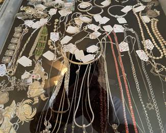 Large selection of sterling necklaces , bracelets, bangles, and southwestern rings , a lot of artist signed jewelry. No sterling left at sale house. Will be brought back in at the time of the sale