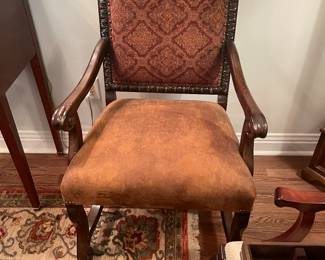 One of two walnut high back armchairs with leather seats