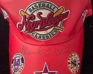 Leather Negro League cap autographed by Buck O’Neil