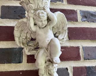 Concrete cherub wall hanging