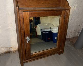 Hanging mirrored cabinet