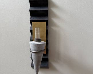 Mixed elements sconce