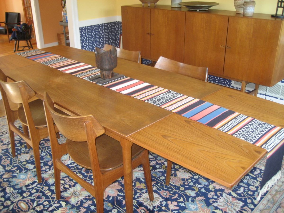 Teak dining table with 2 built-in extensions, 8 teak chairs by Funder-Schmidt & Madsen, Mid Century Danish modern teak buffet, wool area rug