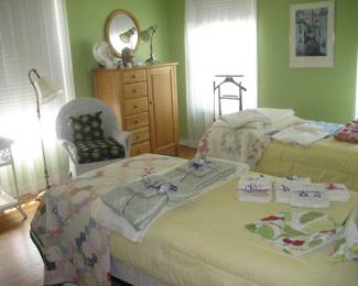 Wood chest and round mirror, single beds