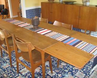 Teak dining table with 2 built-in extensions, 8 teak chairs by Funder-Schmidt & Madsen, Mid Century Danish modern teak buffet, wool area rug