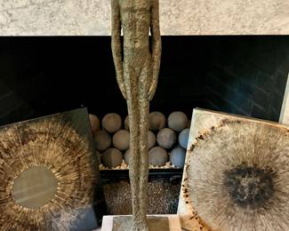 Heavy metal male figure sculpture on a marble base