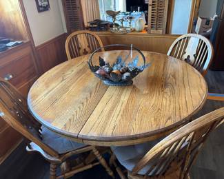 This pedestal table has a leaf to fit your family