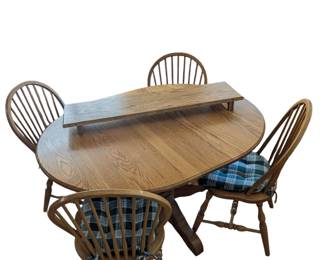 Lot #86 - Amish Round Oak Dining Table with Four Chairs & 2 Leaves