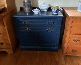 Blue painted commode. Contemporary Erie Canal lamp.