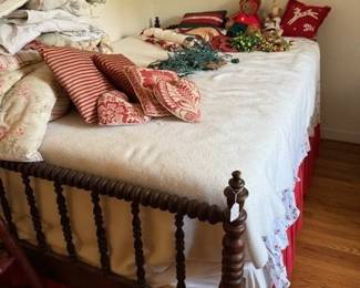Converted Jenny Lind bed to full size. More pillows and linens.