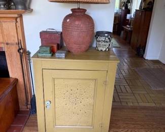 Mustard paint pie safe. Terra cotta contemporary lamp. Early advertising tins.