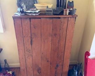 Pune cupboard with interior shelves. Nest of decorated yellow ware bowls. Early tin and pewter. Cast iron bunny door stops on floor