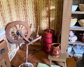 Spinning wheel. Early butter churn.