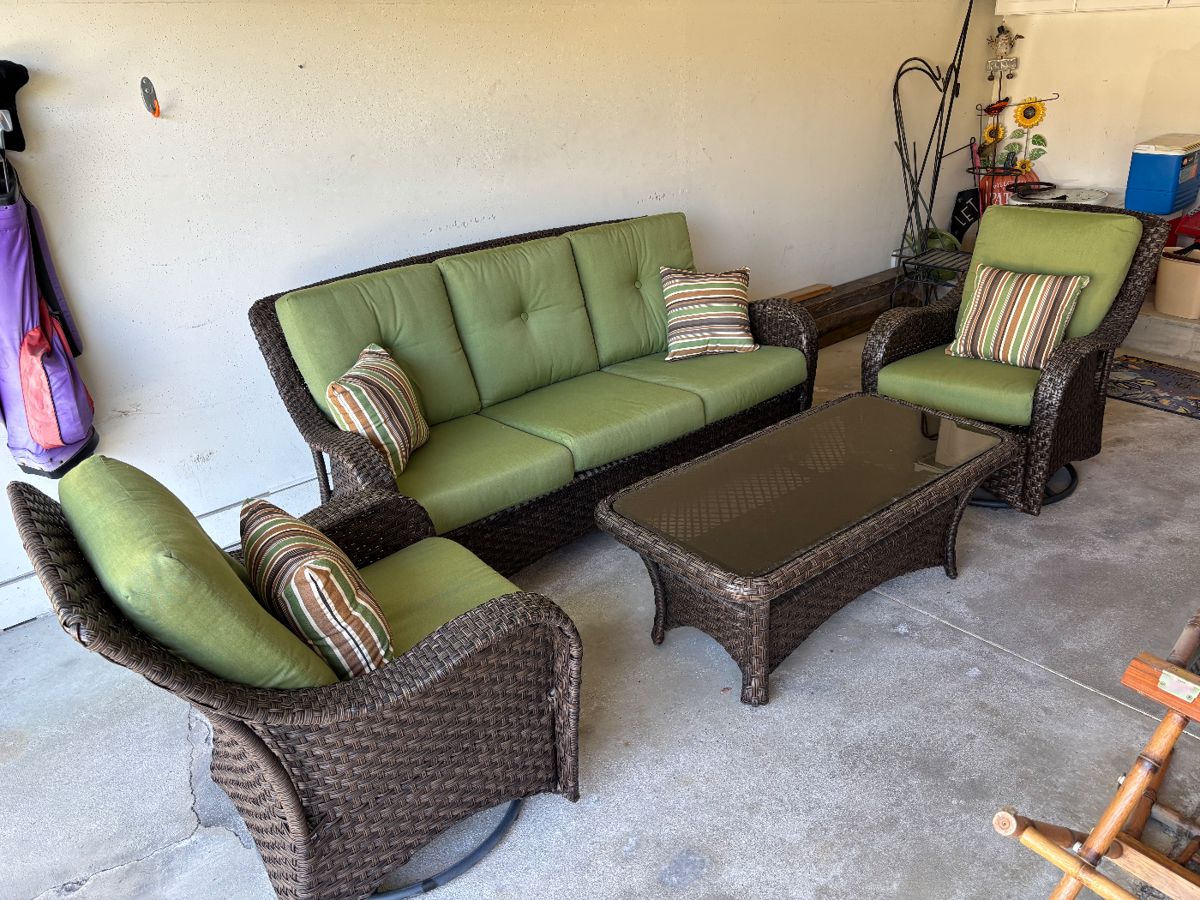Beautiful 4 pc outdoor patio set with cushions. Cushions have been kept inside. Coffee table has glass top.