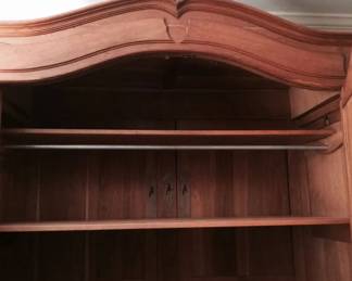 This is an antique armoire - Please view additional photos for a photo of it assembled