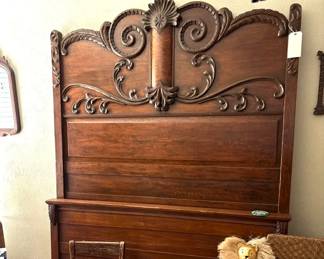 Antique ornate headboard.