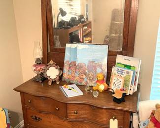 Four drawer antique dresser and mirror.