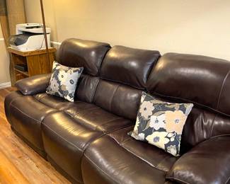 Three piece all recline leather sofa.