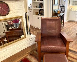 Mission style leather upholstered chair and ottoman.