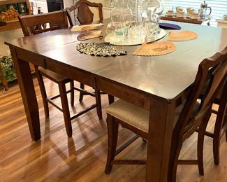 Butterfly leaf dining table and four chairs.