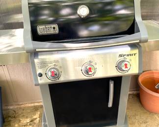 Weber three burner propane grill with new Weber cover and almost full propane tank all included.