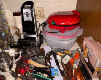 More utensils many vintage ones, storage containers , can openers