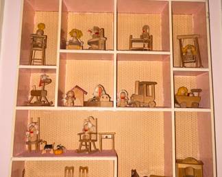 Little wooden miniatures in house display box