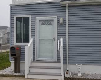 Vinyl railing; Trex stairs; entry door; storm door