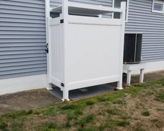 Vinyl outdoor shower surround is approximately 46" wide x 76" deep; has a roof