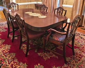 Mahogany Dining Table, two extensions and 6 Chairs.