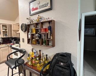 Ogio backpack… lots of great DECORATIVE TEQUILA BOTTLES…. These do not contain alcohol… They contain colorized water for decorative purposes
