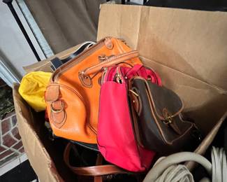 A mountain of designer purses… Coach, Kate Spade, Dooney and Bourke, fossil… You name it