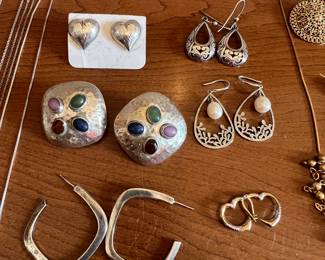 Lots of amazing sterling silver earrings, several signed.