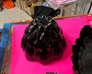 I believe these two unique mid-century modern black glass pieces are made by Viking… But I am not certain if they are missing their stickers.. they might be Blinco.