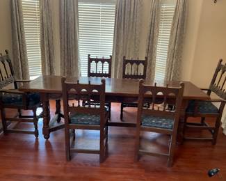 1930’s Solid Oak and Walnut Farm Table with 6 Chairs. Pads are aftermarket but remain with set